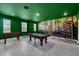 Basement game room with pool table, foosball, and mural at 9194 Sommerset Hills Dr, Davenport, FL 33896