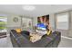 Spacious living room with sectional sofa and large TV at 9194 Sommerset Hills Dr, Davenport, FL 33896