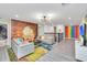 Bright and airy living area with large TV and comfortable seating at 9194 Sommerset Hills Dr, Davenport, FL 33896