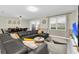 Living area with sectional sofa, view to dining area and pool at 9194 Sommerset Hills Dr, Davenport, FL 33896