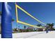 Beach volleyball court with a net and sand at 9194 Sommerset Hills Dr, Davenport, FL 33896