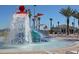 Community waterpark with a waterslide and spray features at 9194 Sommerset Hills Dr, Davenport, FL 33896