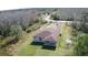 Aerial view of the property, showcasing the backyard and surrounding trees at 9505 Luna Dr, St Cloud, FL 34773
