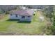 Aerial view of the property, showcasing the backyard and surrounding land at 9505 Luna Dr, St Cloud, FL 34773