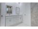 Bathroom with dual sink vanity and neutral tones, providing a clean and functional space at 9505 Luna Dr, St Cloud, FL 34773