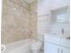 Bathroom with tile shower, toilet and vanity at 9505 Luna Dr, St Cloud, FL 34773