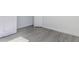 Bedroom with light gray wood-look floors and modern trim, offering style and durability at 9505 Luna Dr, St Cloud, FL 34773