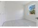 Bright bedroom with tile flooring, a closet, and a window offering natural light, creating a comfortable space at 9505 Luna Dr, St Cloud, FL 34773