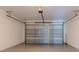 Bright garage with automatic door and storage at 9505 Luna Dr, St Cloud, FL 34773