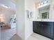 Small bathroom with single vanity and view of bunk bed at 993 Suffolk Pl, Davenport, FL 33896