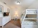Bedroom with bunk beds, dresser, and nightstand at 993 Suffolk Pl, Davenport, FL 33896