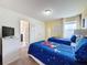 Mickey Mouse themed bedroom with twin beds and a TV at 993 Suffolk Pl, Davenport, FL 33896
