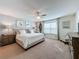 Main bedroom with ceiling fan and neutral color scheme at 993 Suffolk Pl, Davenport, FL 33896