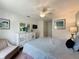 Serene bedroom featuring a dresser, chair, and window at 993 Suffolk Pl, Davenport, FL 33896