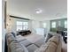 Spacious bonus room with a sitting area and separate dining space at 993 Suffolk Pl, Davenport, FL 33896