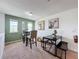 Bright bonus room features a small dining table and chairs at 993 Suffolk Pl, Davenport, FL 33896