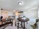Bonus room with seating area, dining table, and open layout at 993 Suffolk Pl, Davenport, FL 33896