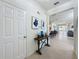 Bright and airy entryway with a console table and view to the living area at 993 Suffolk Pl, Davenport, FL 33896