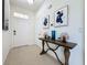 Bright entryway with tile floors and a console table at 993 Suffolk Pl, Davenport, FL 33896