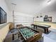 Game room with pool table and foosball table at 993 Suffolk Pl, Davenport, FL 33896