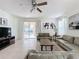 Bright living room with tile floors, comfy seating, and a view of the pool at 993 Suffolk Pl, Davenport, FL 33896
