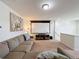 Open living area with projector and window at 993 Suffolk Pl, Davenport, FL 33896