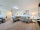 Relaxing living room with sectional sofa and projector at 993 Suffolk Pl, Davenport, FL 33896
