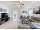 Comfortable living room with sliding glass doors leading to the patio at 993 Suffolk Pl, Davenport, FL 33896