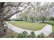 Community dog park with walking path and benches at 10184 Hartford Maroon Rd, Orlando, FL 32827