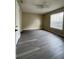 Simple bedroom with gray flooring and window at 1051 S Hiawassee Rd # 2112, Orlando, FL 32835