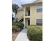 Condo building exterior with walkway and landscaping at 1051 S Hiawassee Rd # 2112, Orlando, FL 32835