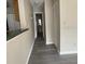Hallway with gray flooring and access to rooms at 1051 S Hiawassee Rd # 2112, Orlando, FL 32835