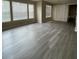 Spacious living room featuring gray vinyl plank flooring at 1051 S Hiawassee Rd # 2112, Orlando, FL 32835