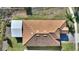 Top-down view of house showing roofline and landscaping at 1131 Blackwolf Run Rd, Davenport, FL 33836