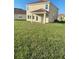 Two-story house with covered patio and spacious backyard at 1144 Trappers Trail Loop, Davenport, FL 33896