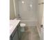 Clean bathroom featuring a bathtub and gray tile at 1144 Trappers Trail Loop, Davenport, FL 33896