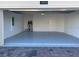 Spacious garage with painted floor and extra space at 1144 Trappers Trail Loop, Davenport, FL 33896