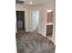 Hallway with grey carpet, doors to bedrooms and bathroom, and laundry closet at 1144 Trappers Trail Loop, Davenport, FL 33896