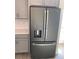 Stainless steel french door refrigerator with ice and water dispenser at 1144 Trappers Trail Loop, Davenport, FL 33896