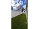 Backyard with a grassy lawn and a white vinyl fence at 115 W Murphy St, Davenport, FL 33837