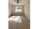 Large bedroom with ceiling fan and tile flooring at 115 W Murphy St, Davenport, FL 33837