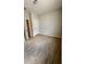 Simple bedroom with tile floors and a door to another room at 115 W Murphy St, Davenport, FL 33837