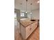 Kitchen island with granite countertop and stainless steel sink at 115 W Murphy St, Davenport, FL 33837