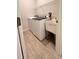 Laundry room with washer, dryer, and utility sink at 115 W Murphy St, Davenport, FL 33837