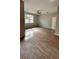 Bright and airy living room with large window and tile flooring at 115 W Murphy St, Davenport, FL 33837