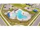 Community pool and surrounding recreational areas from above at 1274 Fury St, Davenport, FL 33837