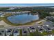 Aerial view of community with pond at 1274 Fury St, Davenport, FL 33837