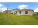 Spacious backyard with lush grass and a view of neighboring homes at 1274 Fury St, Davenport, FL 33837