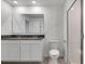 Bathroom with double vanity, shower, and toilet at 1274 Fury St, Davenport, FL 33837