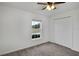 Bright bedroom with carpet flooring and double doors at 1274 Fury St, Davenport, FL 33837